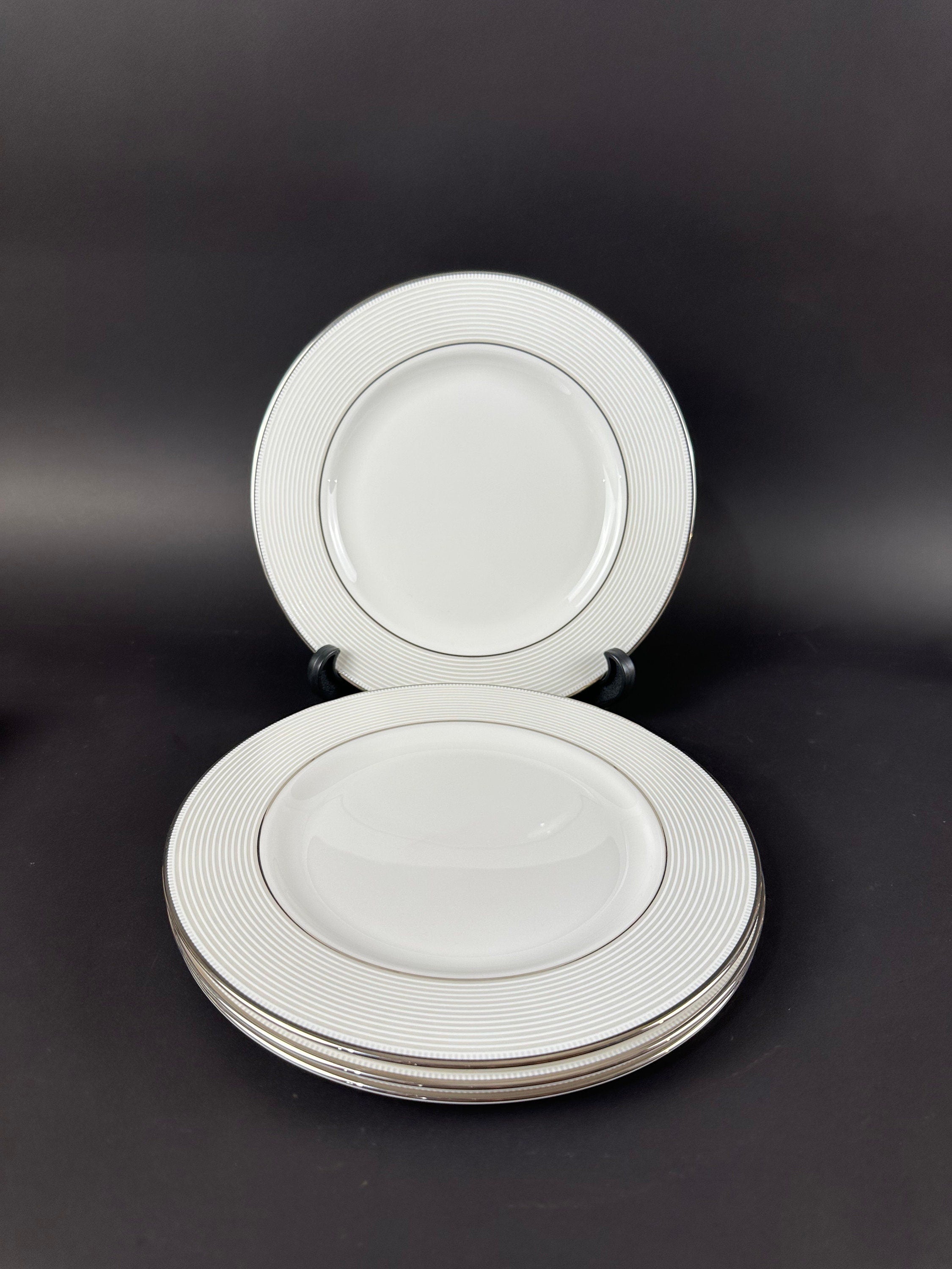 Four Lenox “Opal Innocence Stripe” Salad Plates by Kate Spade.