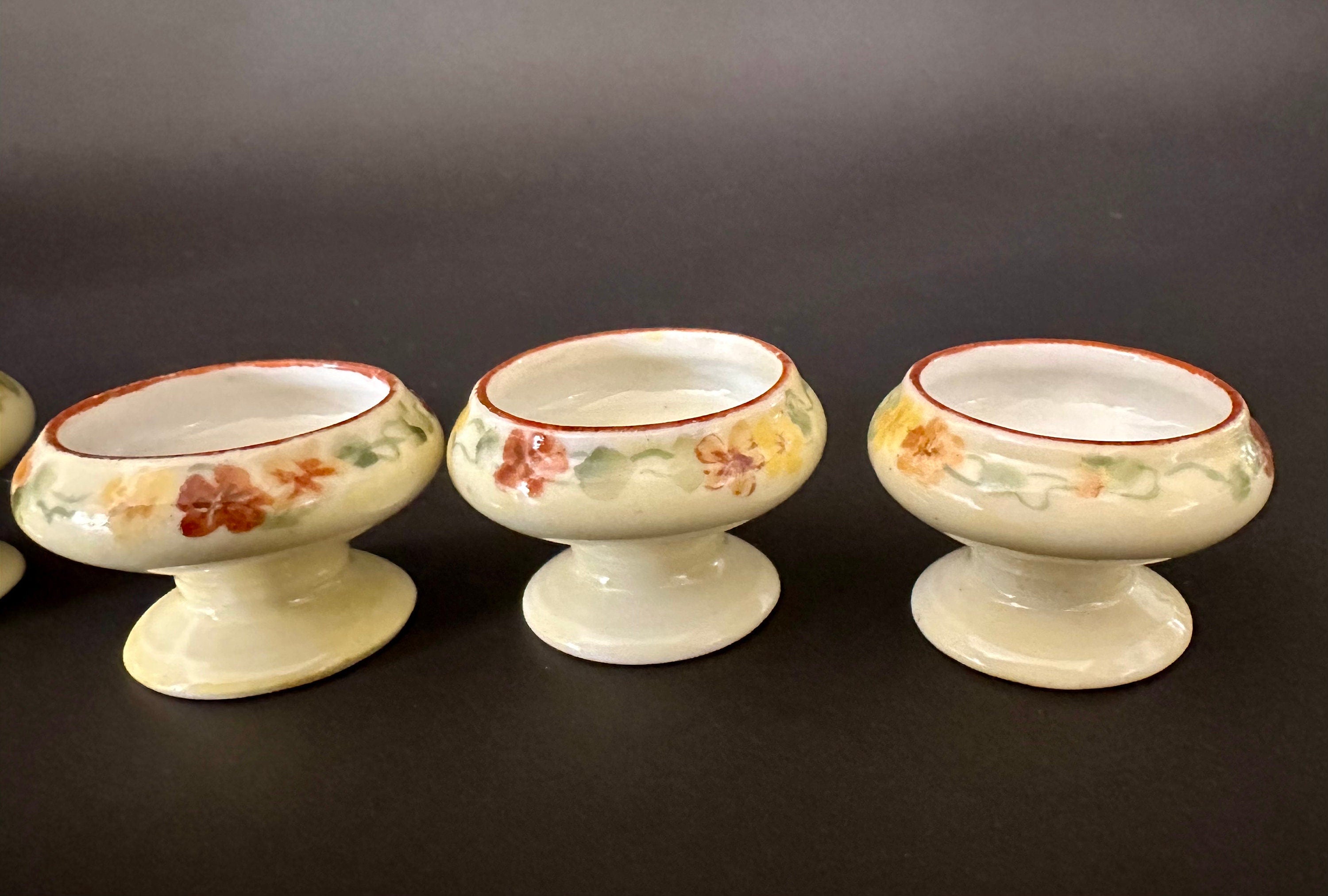 Four Antique Hand Painted Salt Cellars