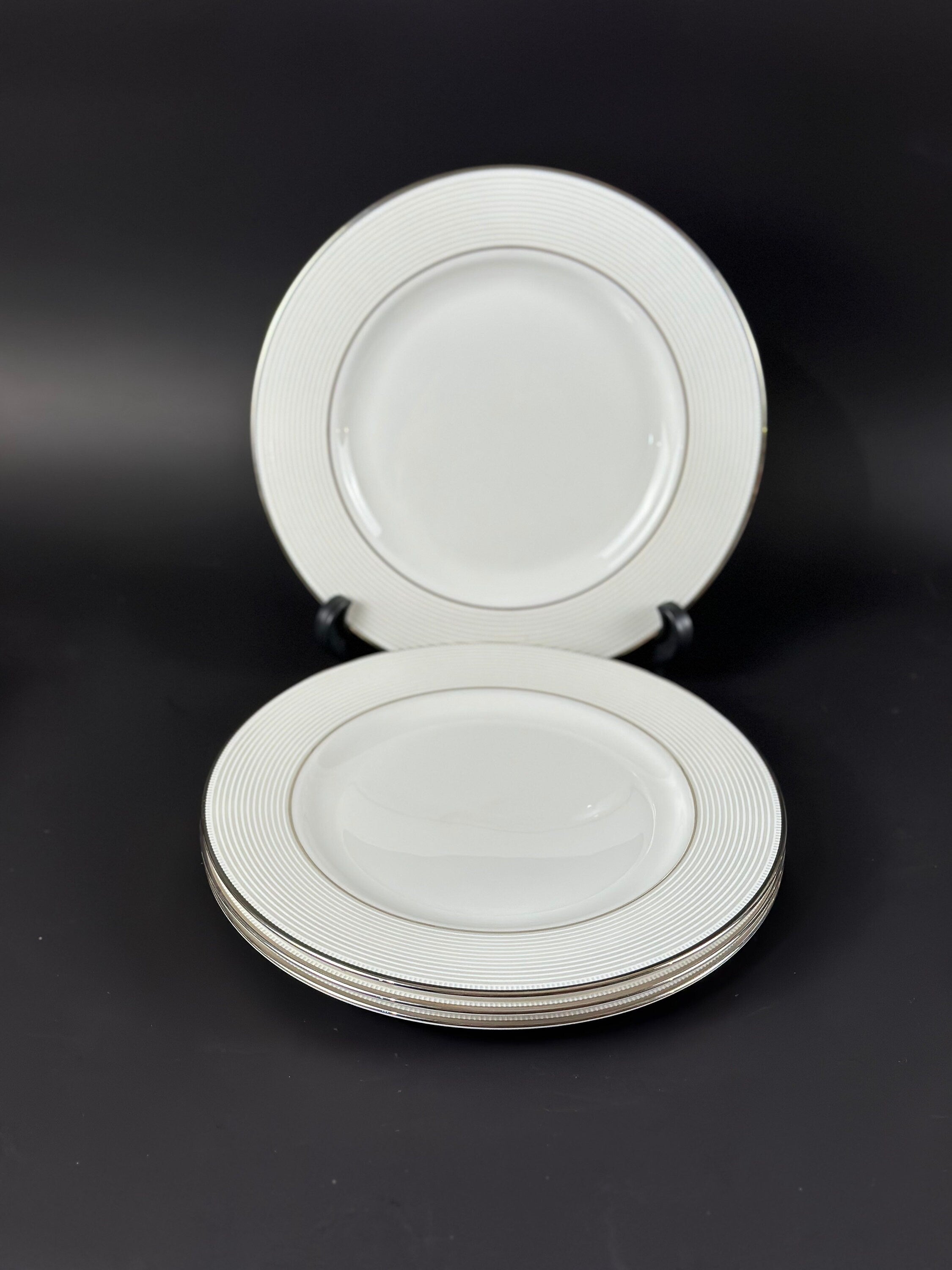 Four Lenox “Opal Innocence Stripe” Salad Plates by Kate Spade.