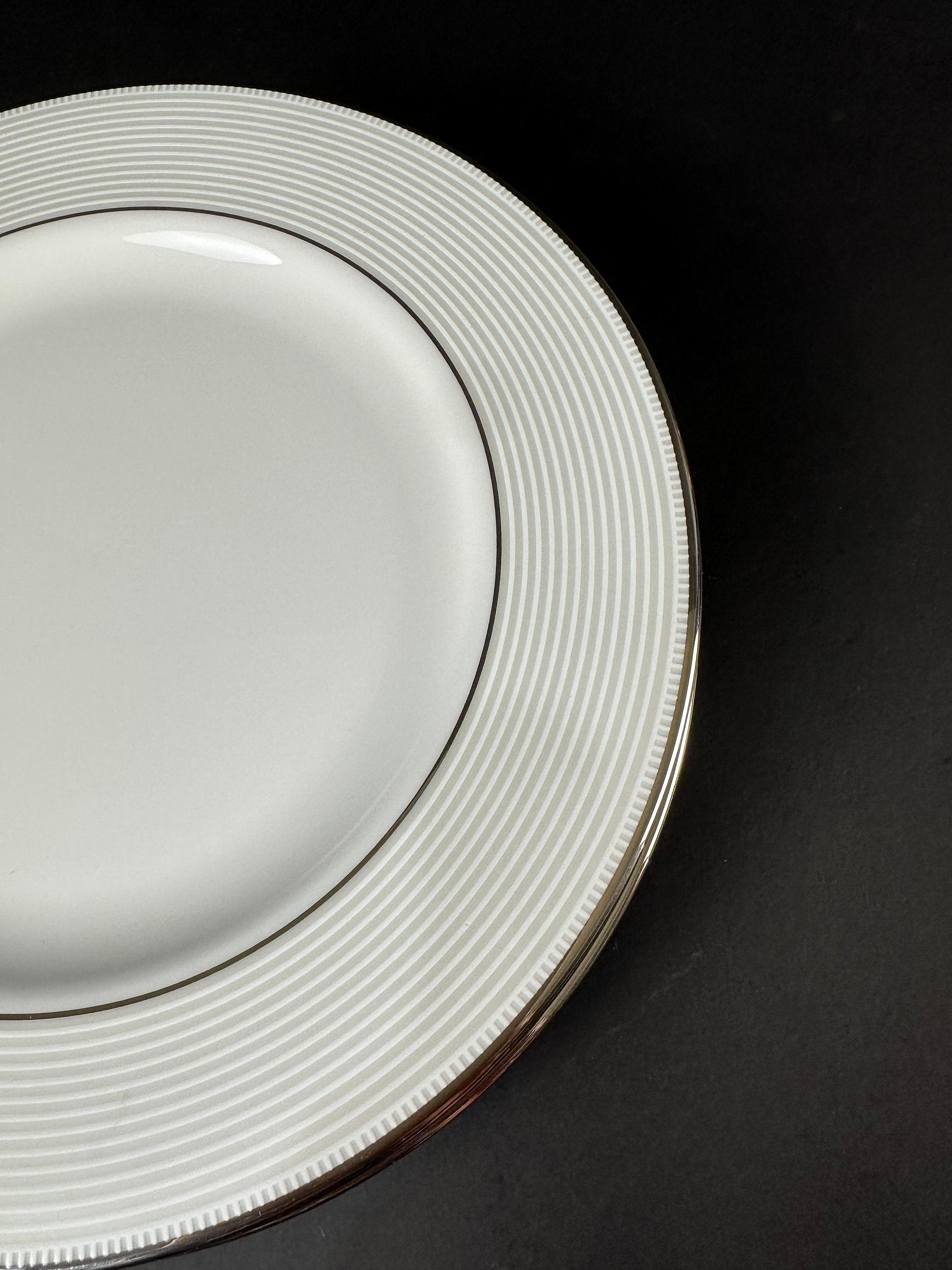 Four Lenox “Opal Innocence Stripe” Salad Plates by Kate Spade.
