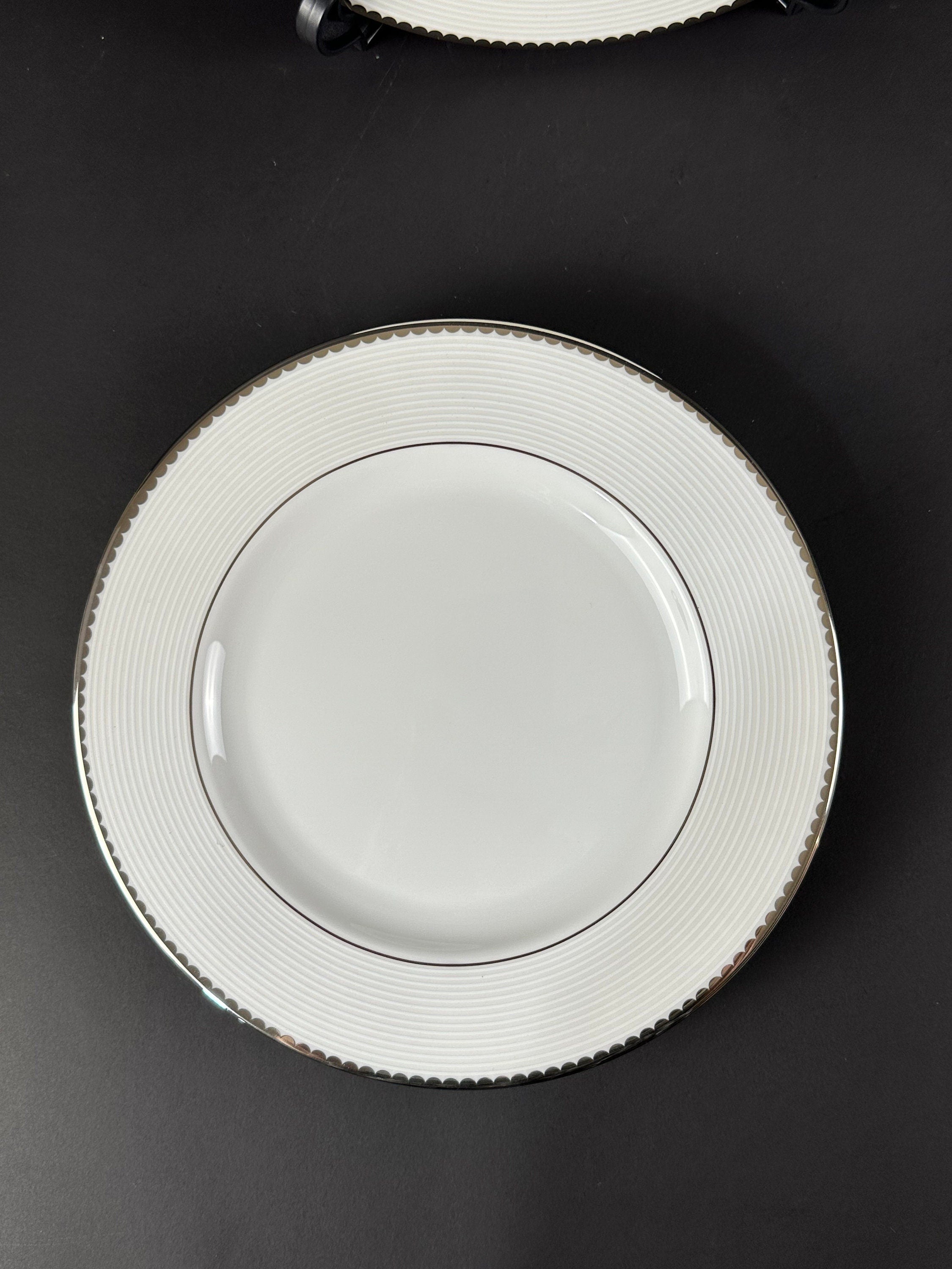 Four Lenox “Sugar Point” Pattern Salad Plates by Kate Spade.