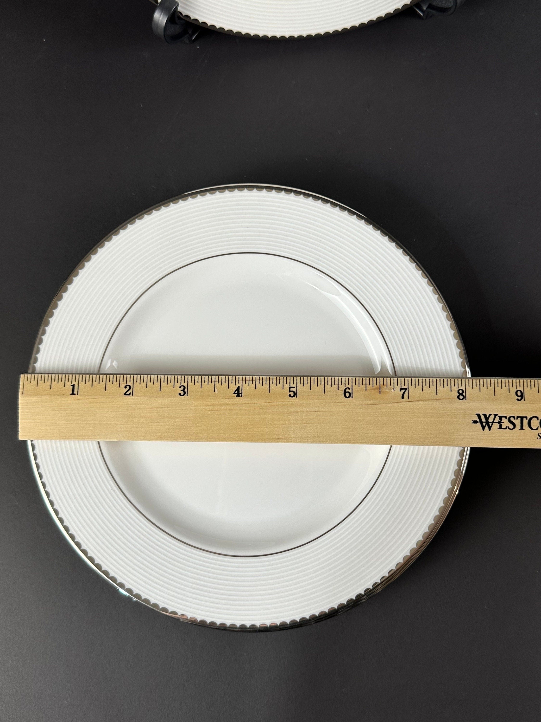 Four Lenox “Sugar Point” Pattern Salad Plates by Kate Spade.