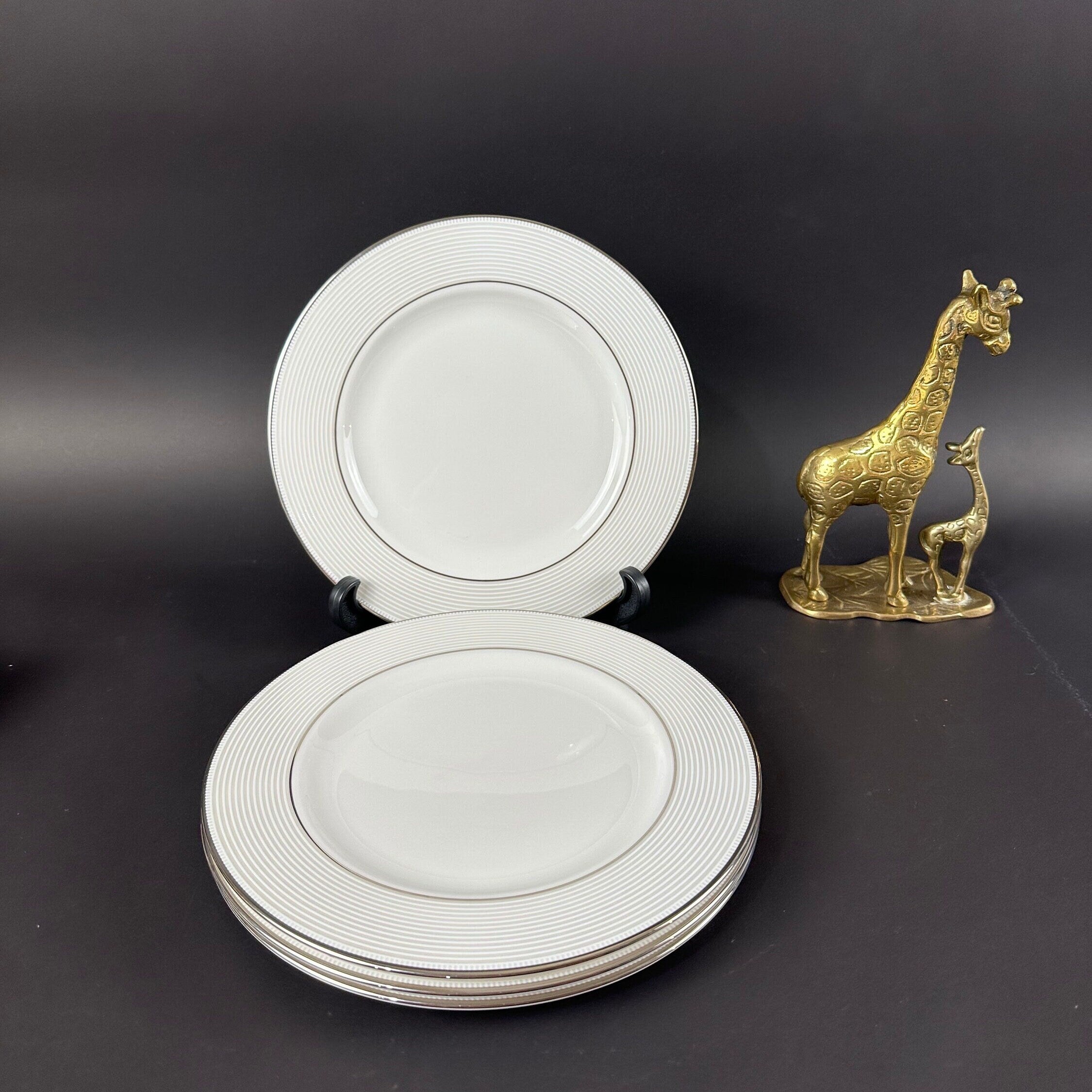 Four Lenox “Opal Innocence Stripe” Salad Plates by Kate Spade.