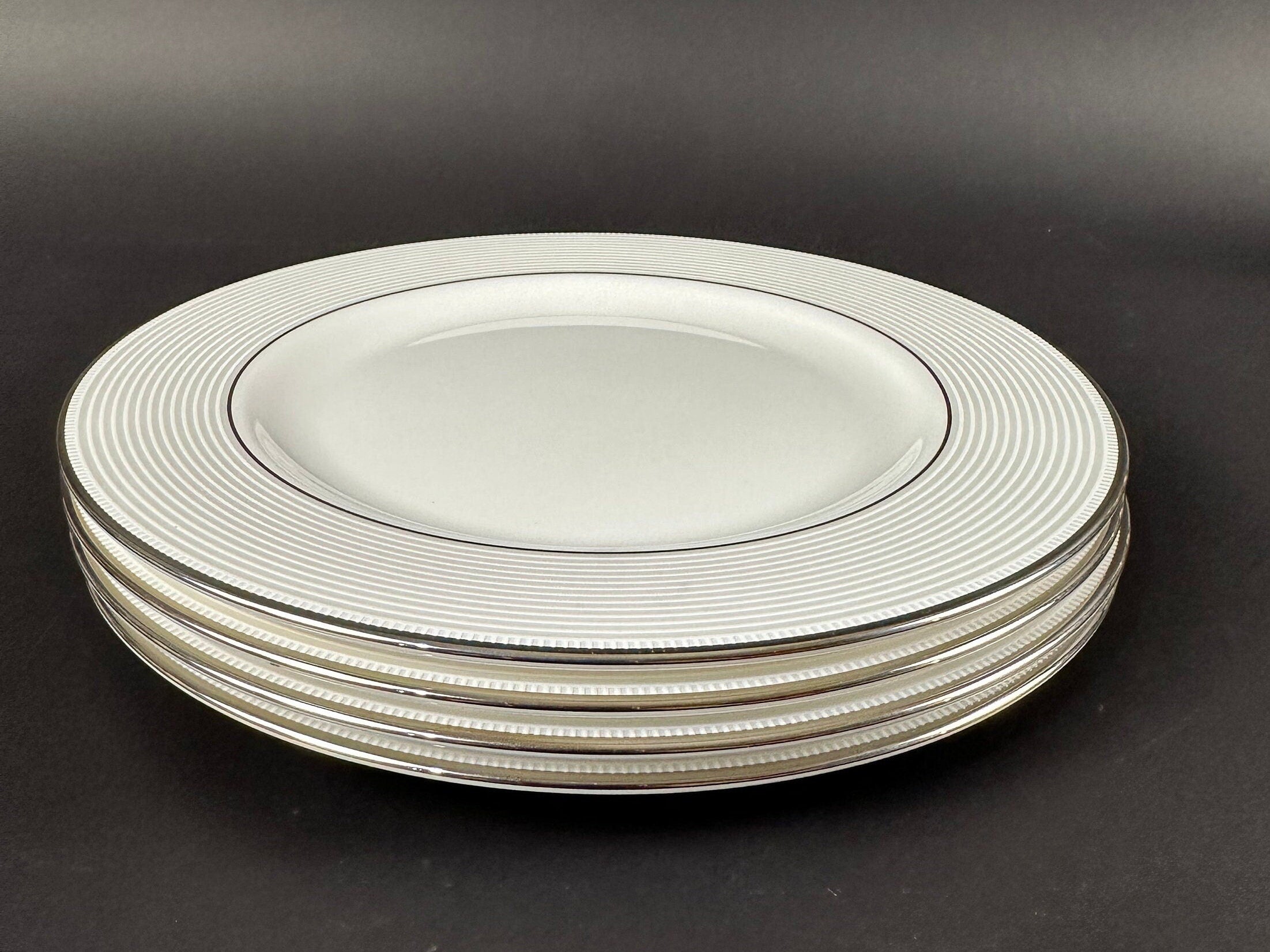 Four Lenox “Opal Innocence Stripe” Salad Plates by Kate Spade.