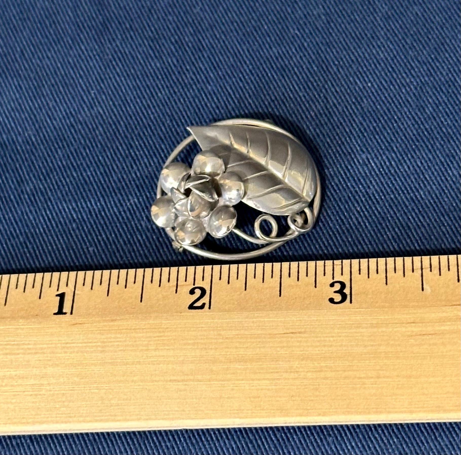 Vintage Sterling Silver Circle Brooch With Flower and Leaf