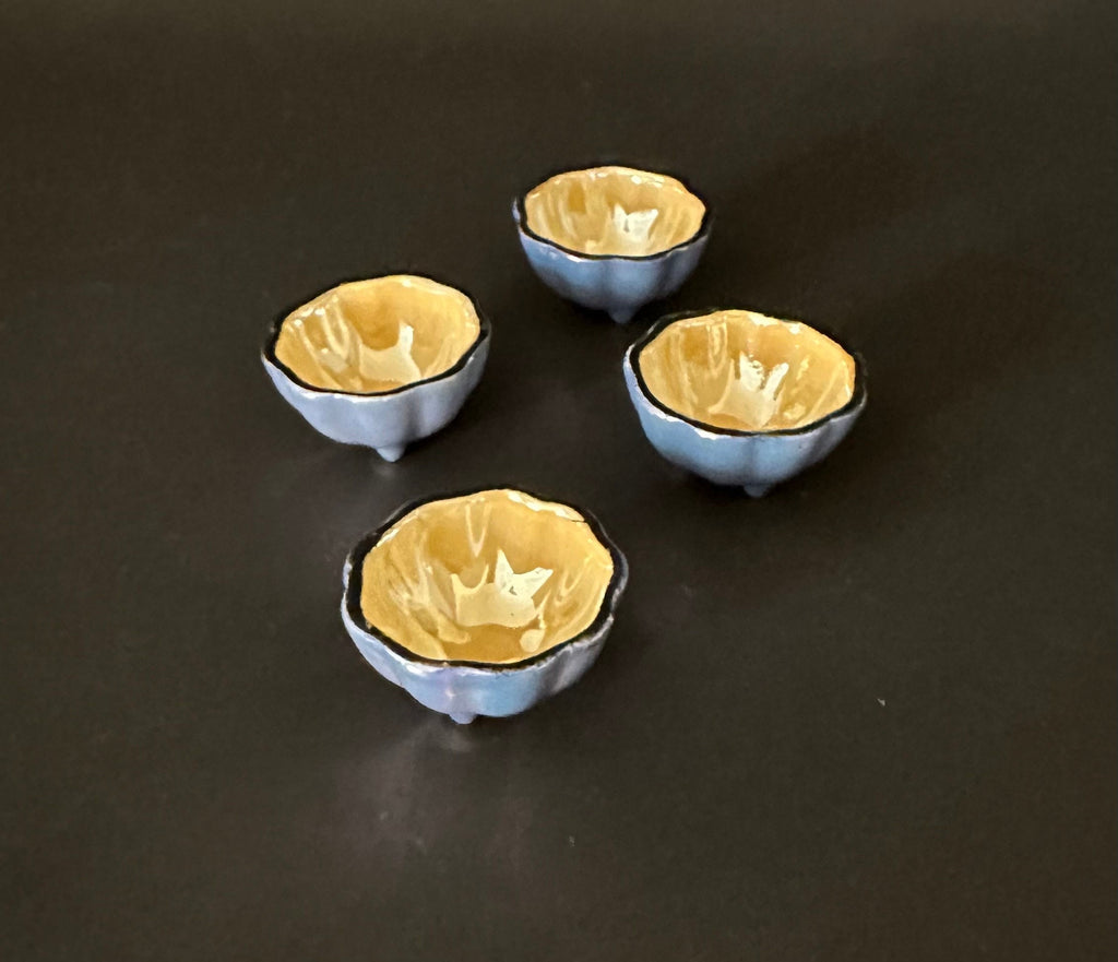 Four Irridescent Lusterware Salt Cellars