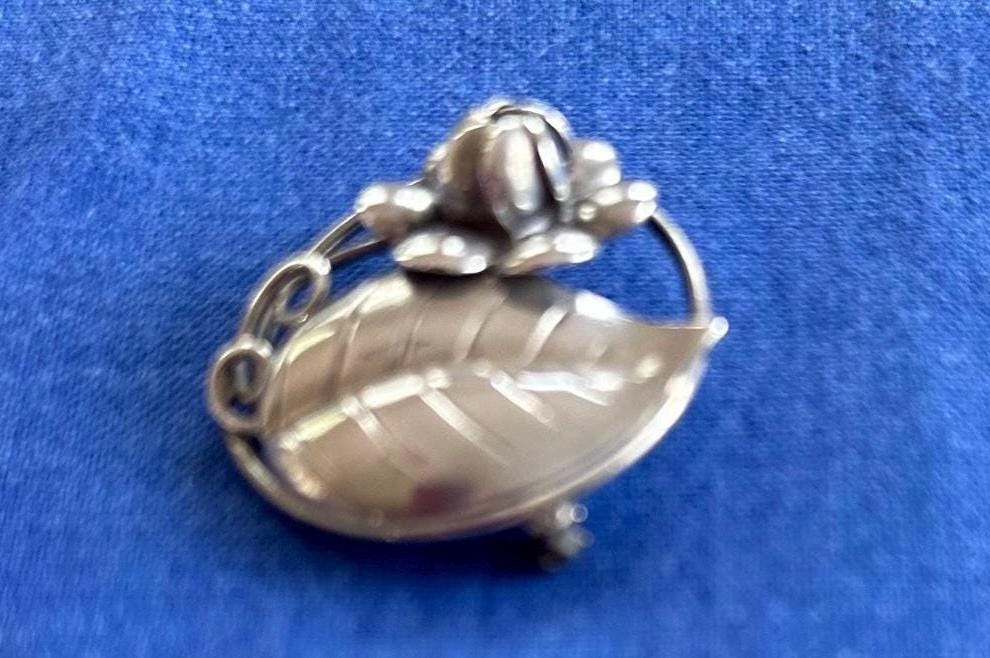 Vintage Sterling Silver Circle Brooch With Flower and Leaf