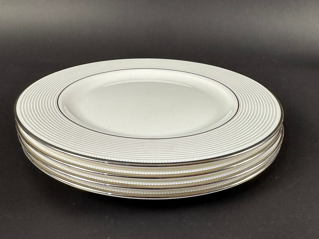 Four Lenox “Opal Innocence Stripe” Salad Plates by Kate Spade.